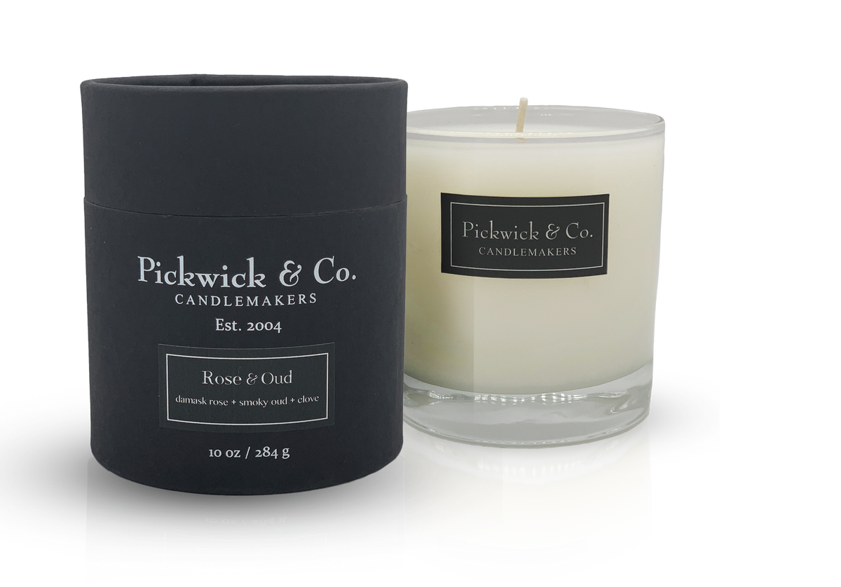 Pickwick Candle in Rose Oud scent with a white wax body and black wick.