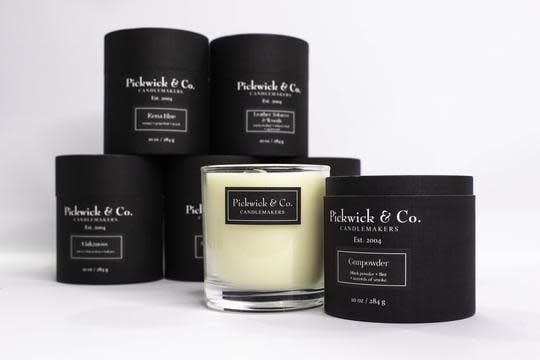 White ceramic jar candle with a black wick labeled Pickwick Candle