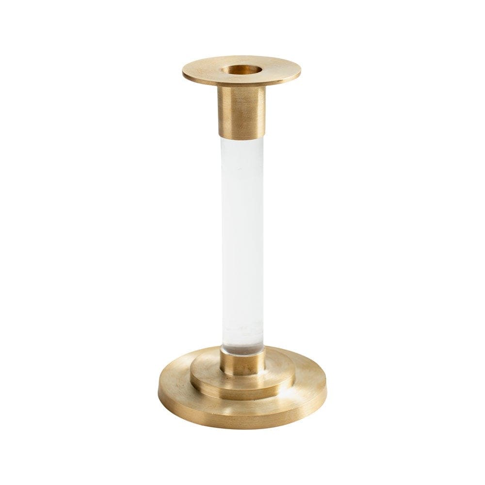 Small brass candlestick with clear resin accents holding a tapered white candle