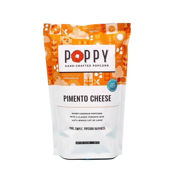 Front view of Market Bag Popcorn in white cheddar flavor with visible seasoning.
