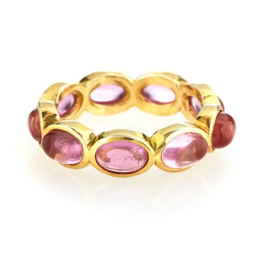 Pink quartz continuous gemstone ring with a sleek band featuring an unbroken row of stones.