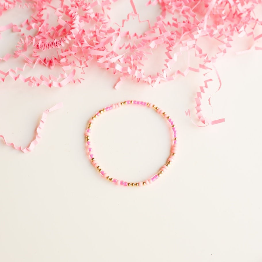 Pink sprinkle bracelet featuring colorful Czech glass beads with gold-filled accents.