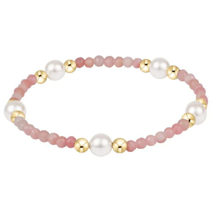 Pinkopal gem bracelet featuring a purpose pattern with 6mm crystal pearls and gold-filled beads on elastic.