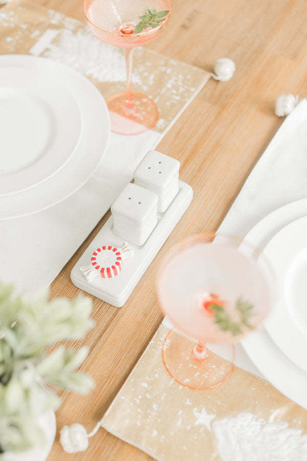 Pinstripe-patterned salt and pepper shaker set with a classic cylindrical silhouette.