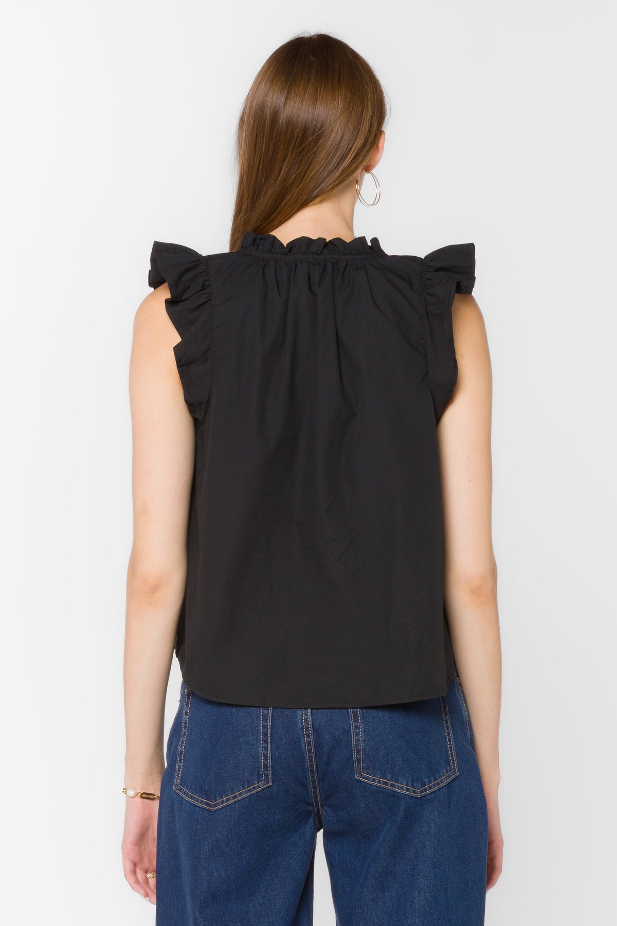 Black poplin sleeveless top with Mandarin collar, tie detail V-neckline, and ruffle edge.