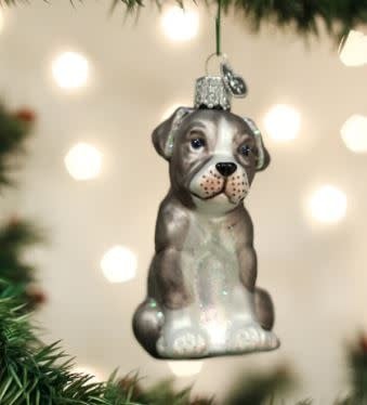 Red plastic Pitbull dog ornament with a glossy finish.