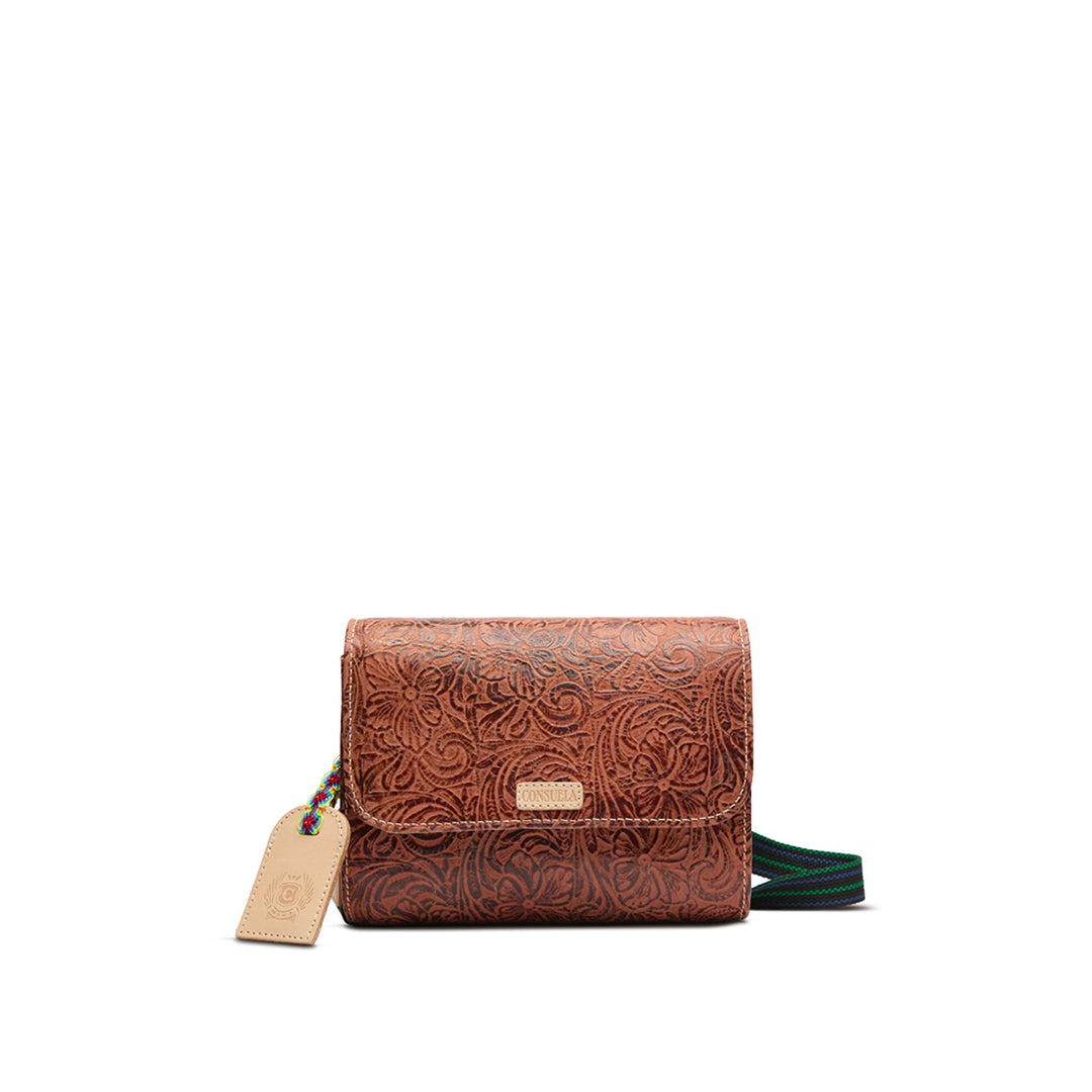 Sally On the Town brown tooled leather crossbody bag with a woven strap and logo tag.