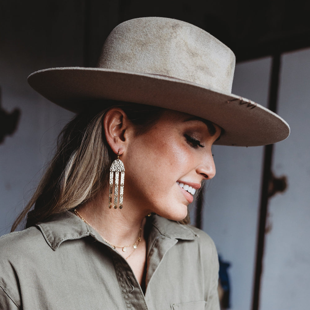 Xandra hammered gold statement earring with textured finish