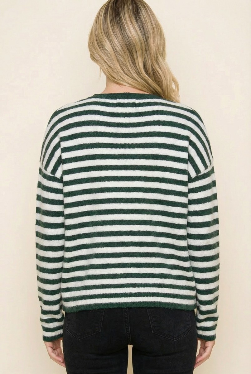Back view of a woman wearing a green and white horizontal striped knit cardigan.