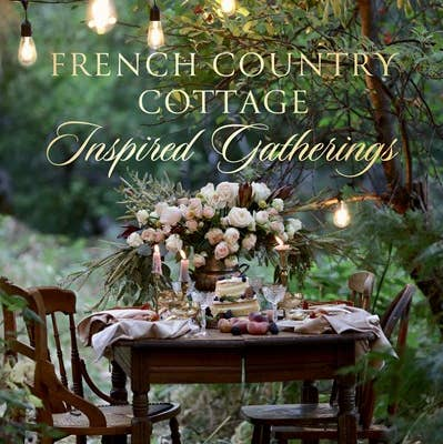 Book cover for French Country Cottage Inspired Gatherings featuring an outdoor table setting.