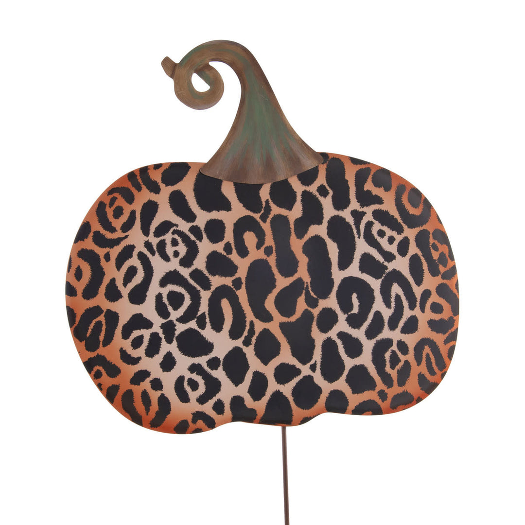 Large metal leopard print pumpkin decoration with a brown stem and a garden stake.