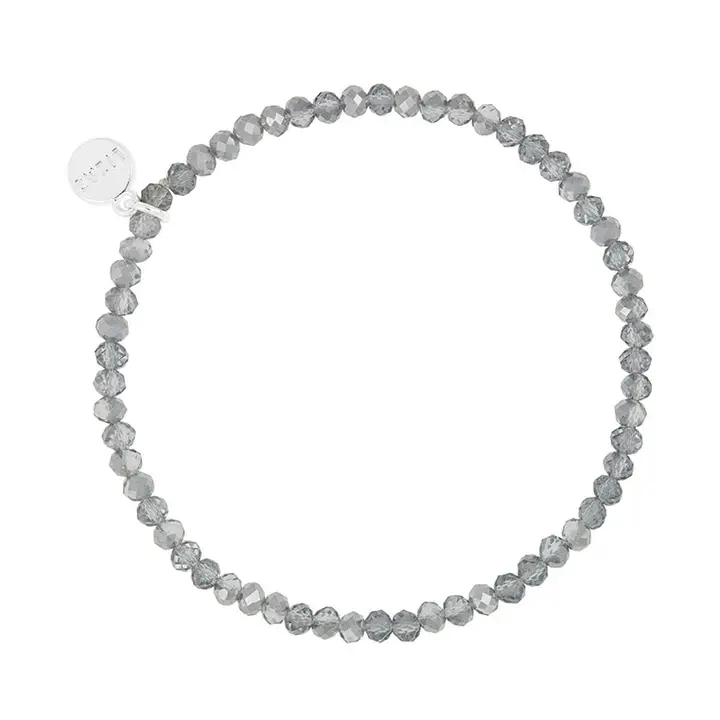 Lizas Quadro grey faceted crystal stretch bracelet with a silver-tone logo charm.