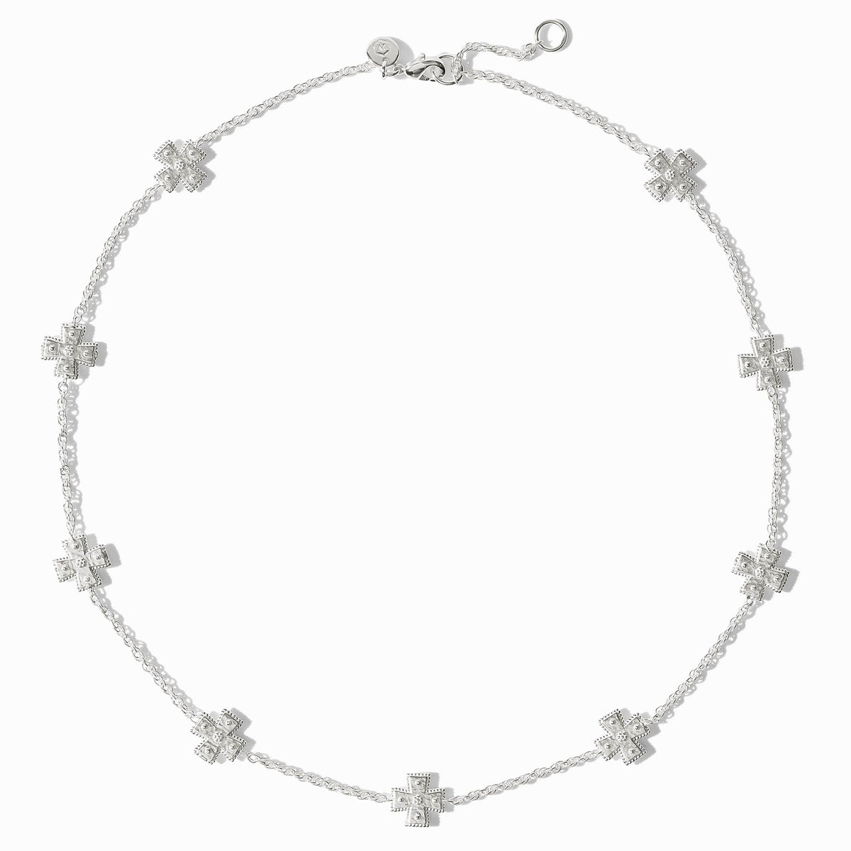 Canterbury silver station necklace featuring nine small cross-shaped charms on a delicate chain.