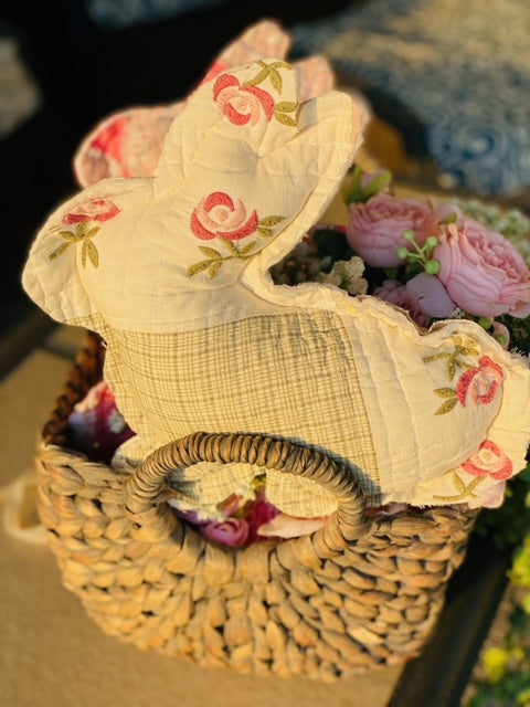 Vintage fabric Easter bunny made from quilt scraps with a soft pastel pattern.