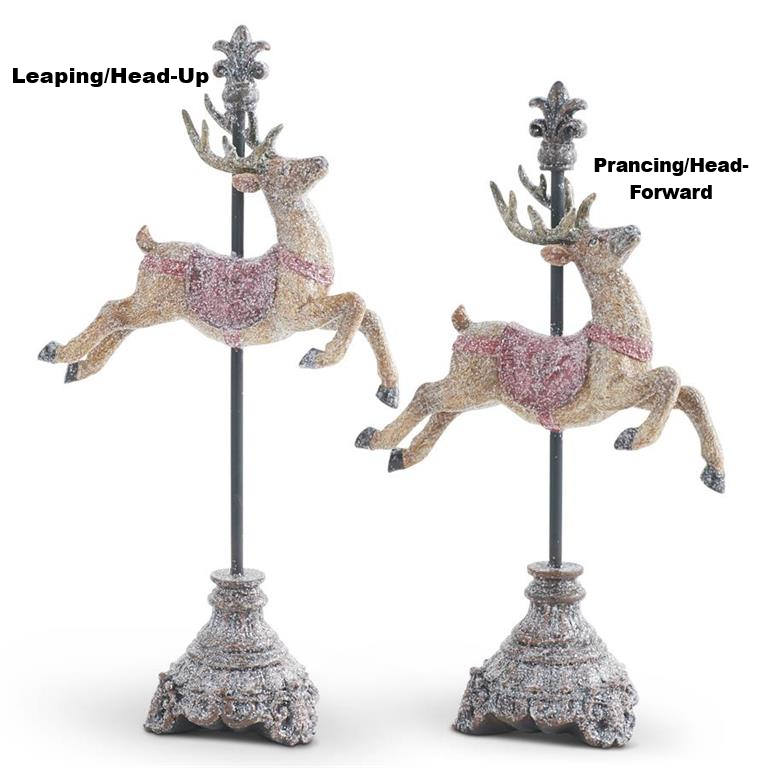 Two glittered resin reindeer figurines on finial stands, one leaping and one prancing.