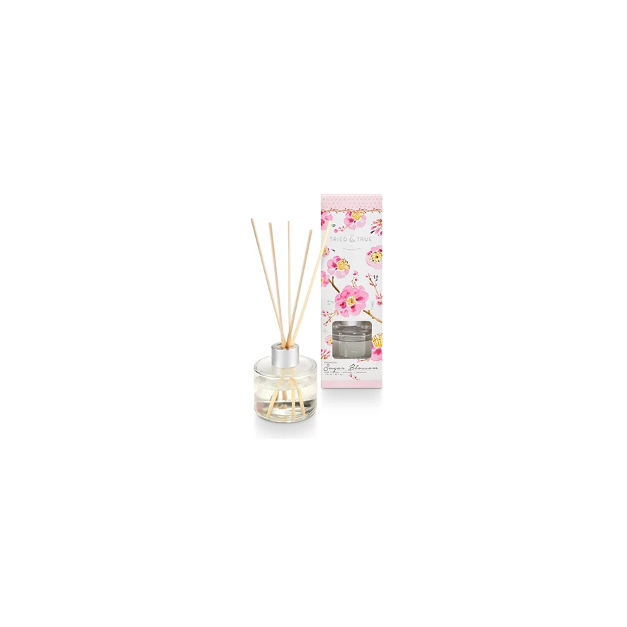 Glass reed diffuser bottle with Sugar Blossom fragrance label