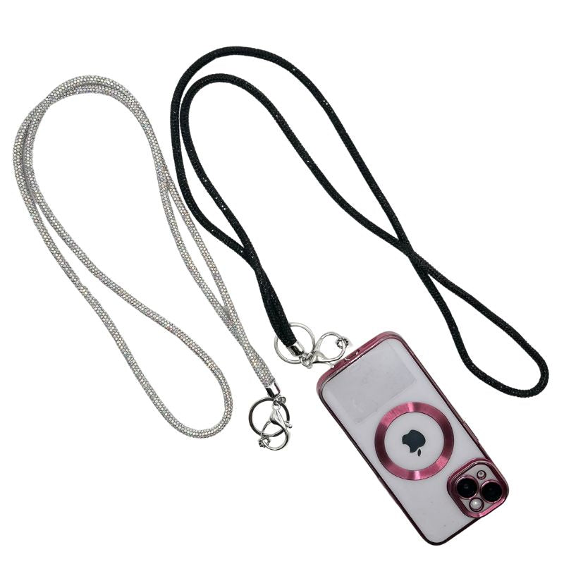 Two sparkling lanyards, one silver and one black, attached to a pink-rimmed phone case with an Apple logo.