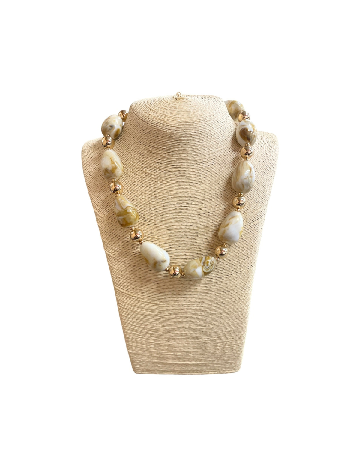 Acrylic pebble multi-beaded necklace with marbled cream and tan stones and gold spacers.