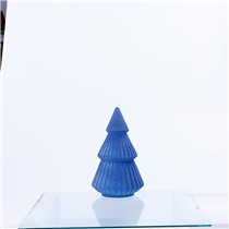 Blue glass Christmas tree with a classic conical silhouette.