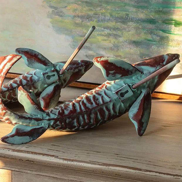 Set of two swimming koi fish wall sculptures with a verdigris and copper finish.