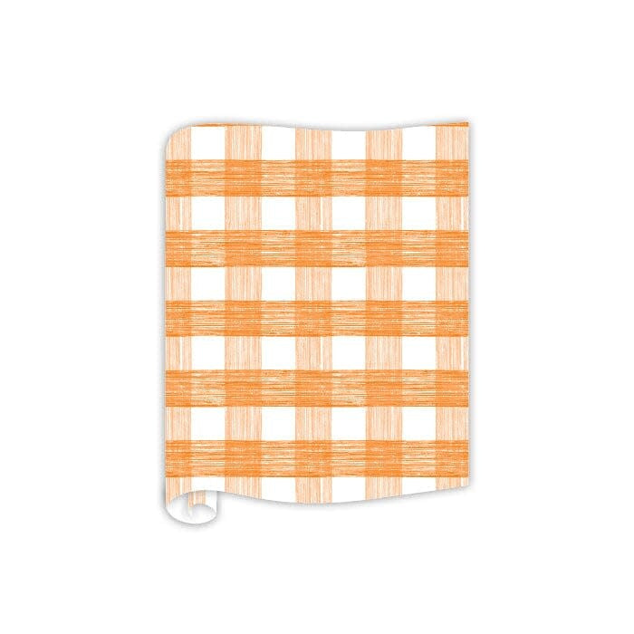 Orange plaid paper table runner with a continuous roll design.