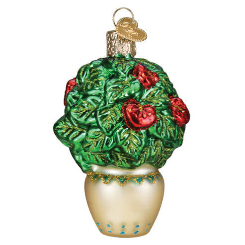 White ceramic ornament shaped like a potted plant with green leaves.