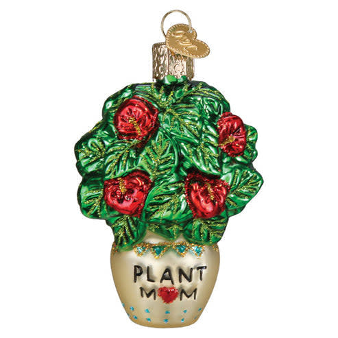 White ceramic ornament shaped like a potted succulent with green leaves.