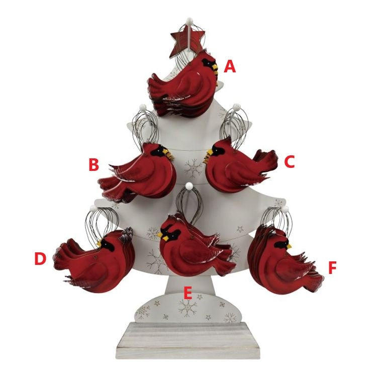 Red epoxy resin cardinal ornament with natural plywood wings hanging from a gold hook.