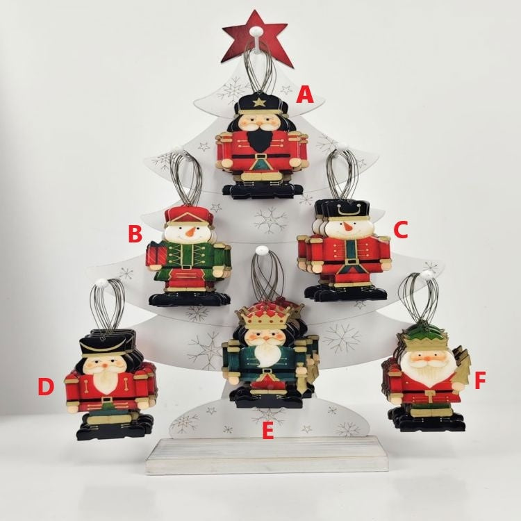 Plywood nutcracker ornament with epoxy accents in a classic soldier silhouette.