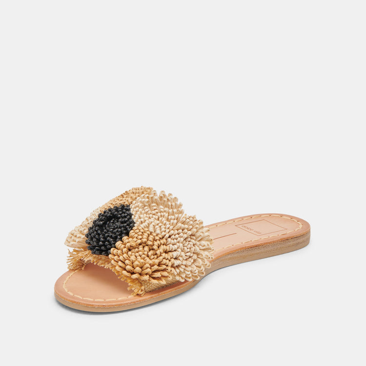 Danela Sandals featuring a tan raffia upper with a black beaded floral accent on a flat sole.