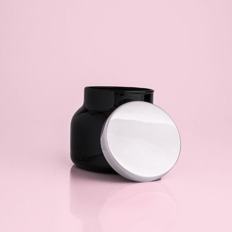 Black petite signature jar candle with a black wick in an 8 oz glass container.