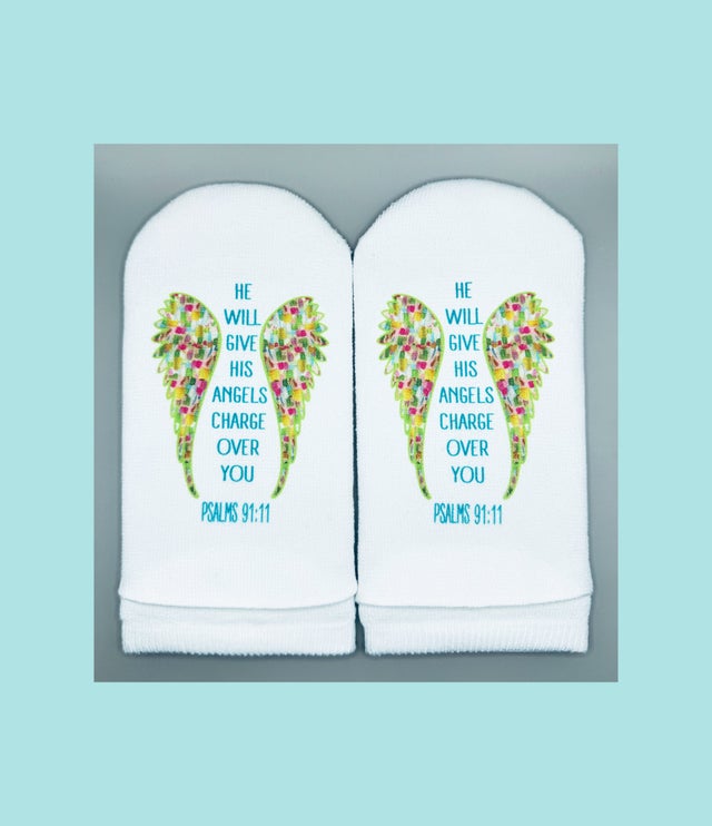 White no-show socks with colorful angel wings and the text 'Psalms 91:11' in blue.