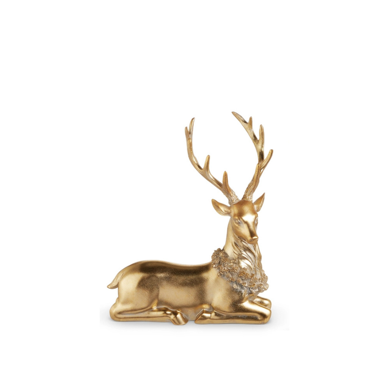 Gold resting deer figurine with a wreath around its neck and multi-point antlers.