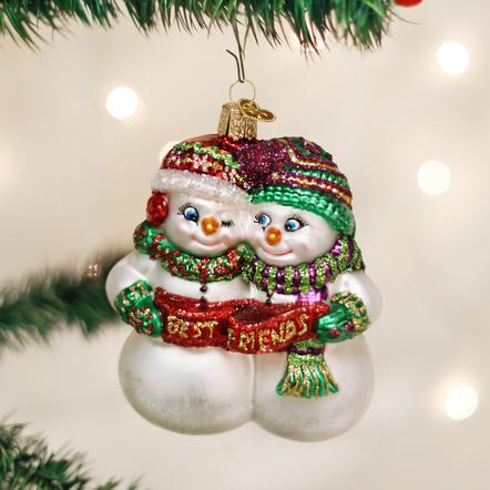 Glass snowman ornament featuring two snowmen hugging and holding a red banner saying Best Friends.