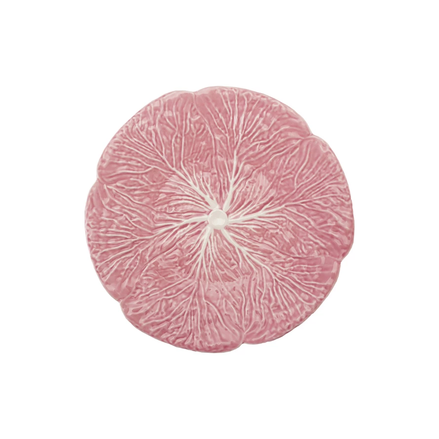 Pink stoneware plate shaped like a cabbage with textured leaf edges.