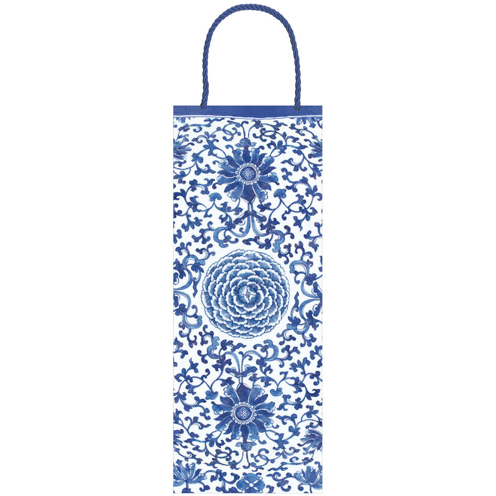 Indigo Garden blue bottle bag with white accents, durable paper material, strong handle, and dimensions L 5 in x W 3.5 in x H 13 in.