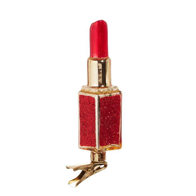 Red and gold glass lipstick clip-on Christmas ornament with glitter accents.