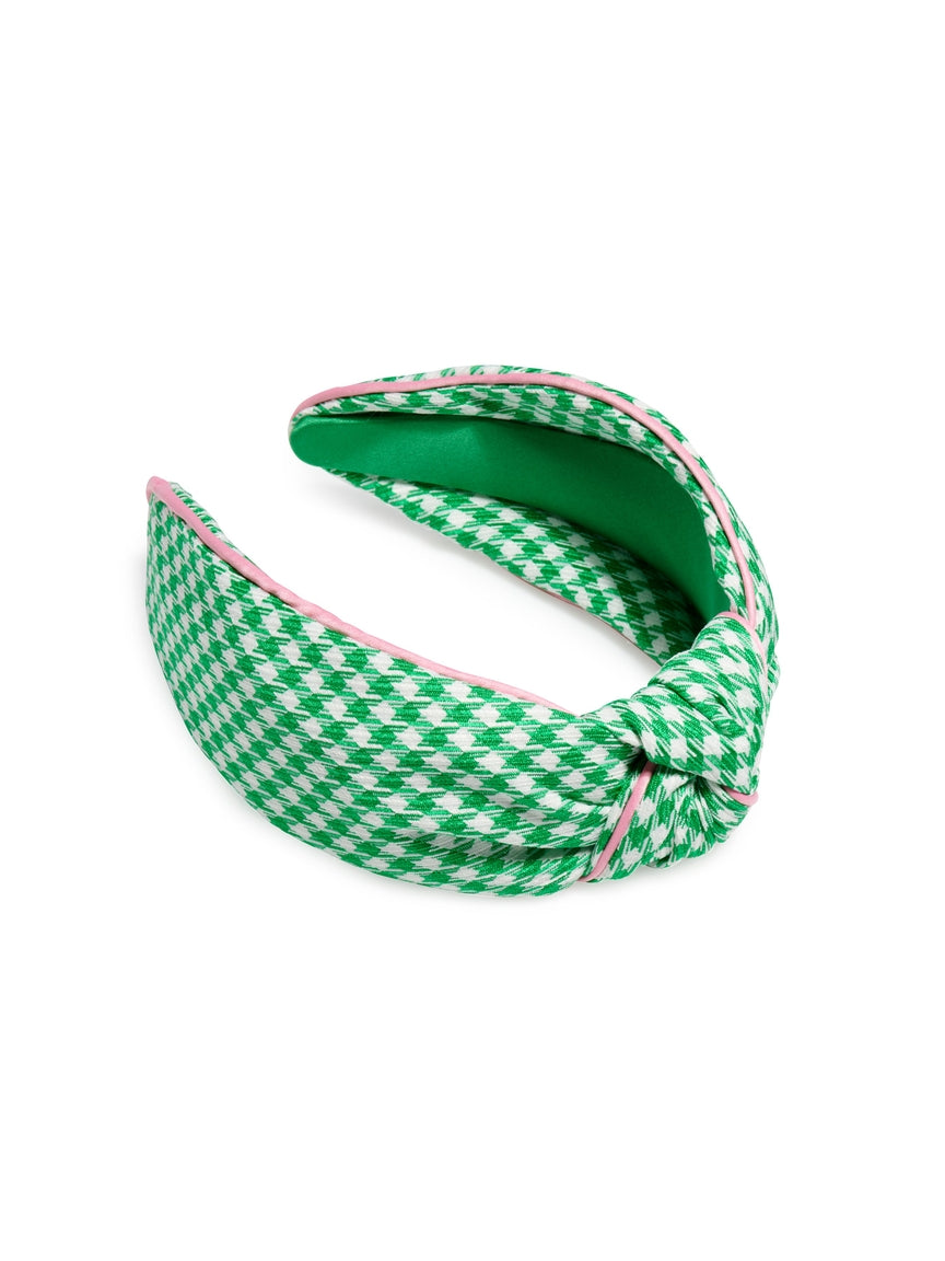 Green houndstooth knotted headband with a twisted fabric knot detail.