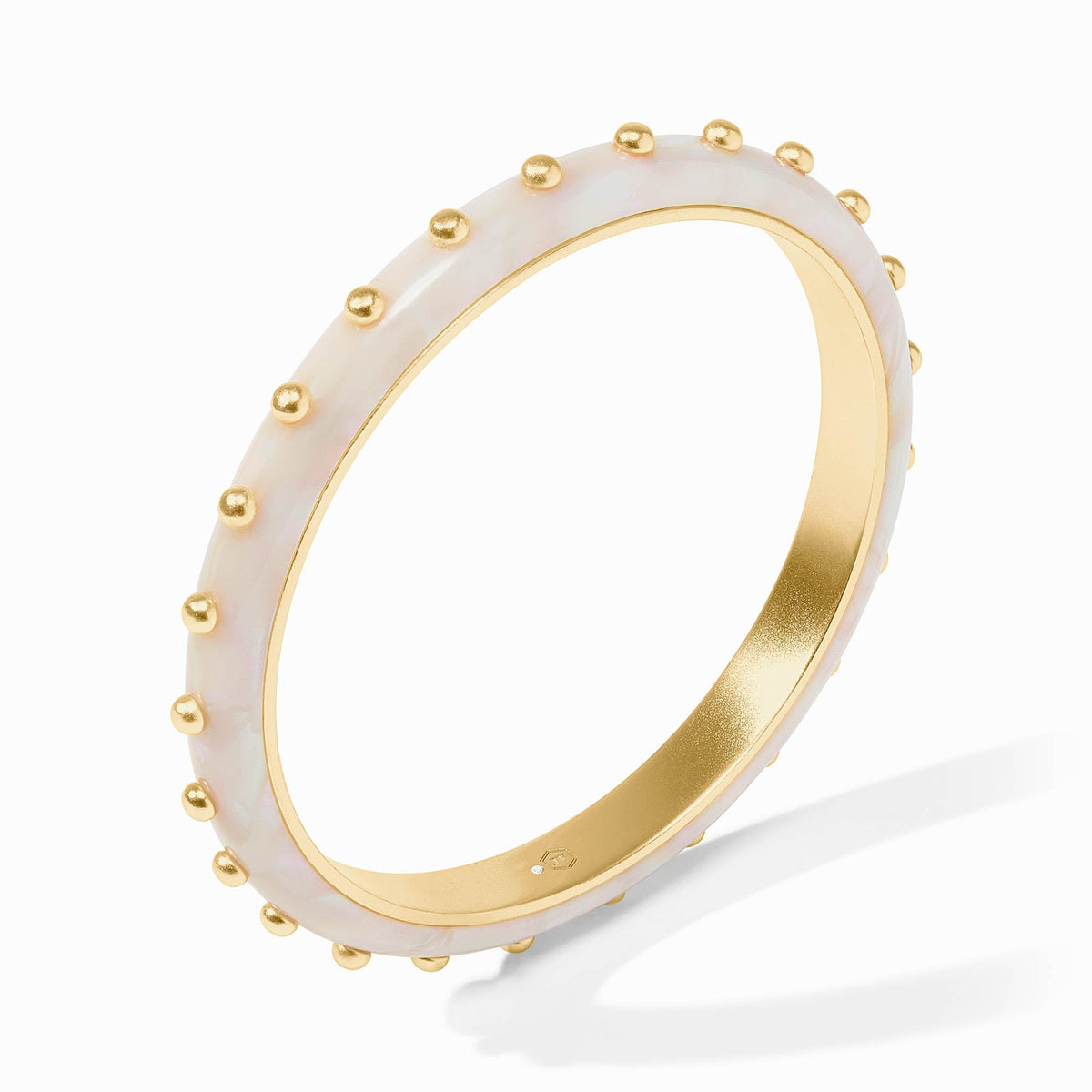 Colette bangle in gold-plated acetate with a sleek narrow silhouette.