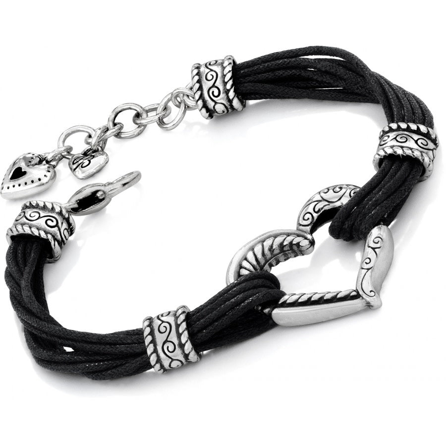Adjustable silver-plated cotton cord bracelet with a heart-shaped pendant.