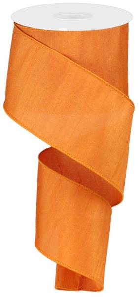 Pumpkin-colored faux dupioni ribbon made from polyester with a subtle sheen and gathered texture.