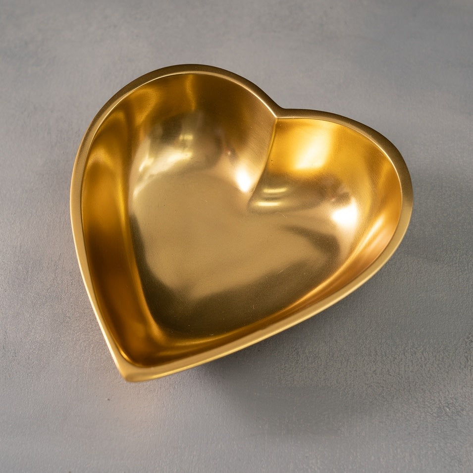 Large polished gold aluminum heart-shaped serving bowl with smooth finish