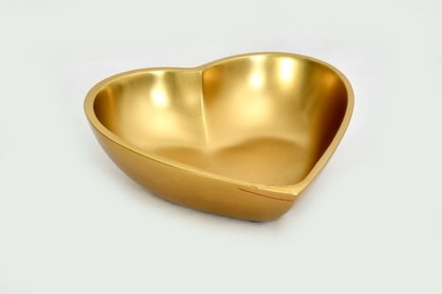 Large polished gold aluminum heart-shaped serving bowl with smooth finish