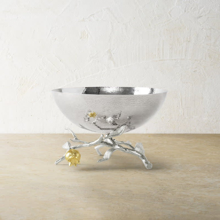 Small stainless steel bowl with nickelplate silver finish and gold accents shaped like a pomegranate.