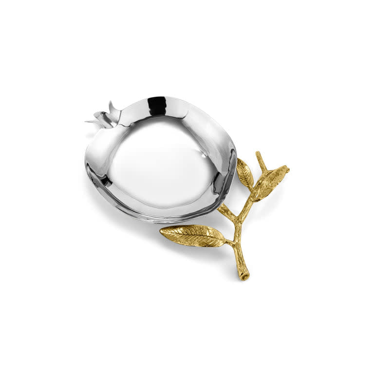 Stainless steel spoon rest shaped like a pomegranate with brass plate accents.