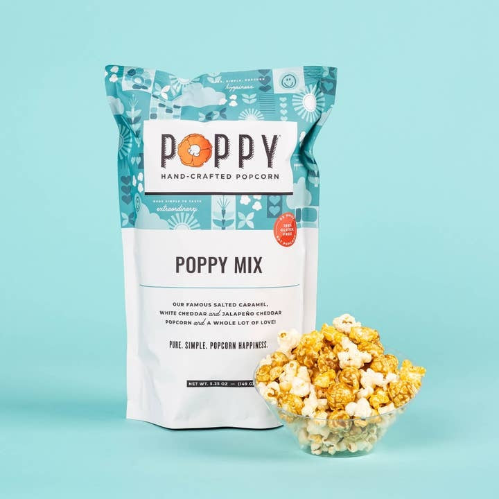 Open bag of white cheddar popcorn with visible dill flakes inside.