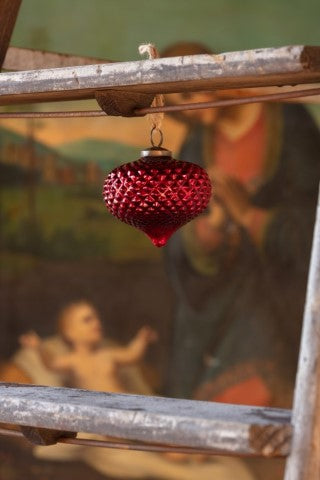 Onion-shaped 4-inch ruby glass ornament with a hobnail texture hanging from a wooden frame.