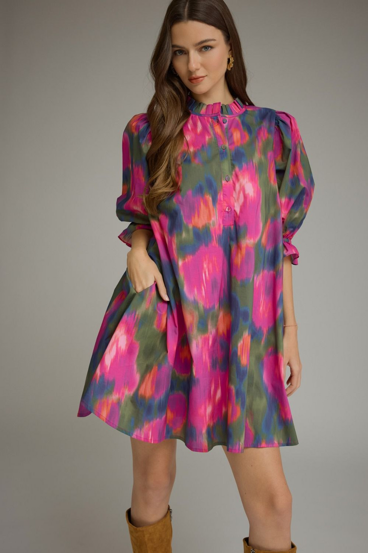 Agatha Printed Puff Sleeve Mini Dress with a ruffled mock neck and vibrant pink and green pattern.