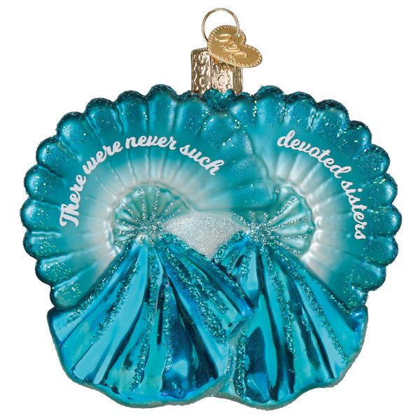 Blue glass shell ornament with white text reading "There were never such devoted sisters."