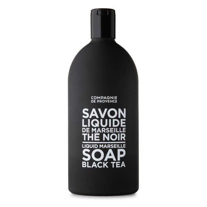 Refill bottle of Compagnie de Provence Black Tea Liquid Marseille Soap in a matte black container.